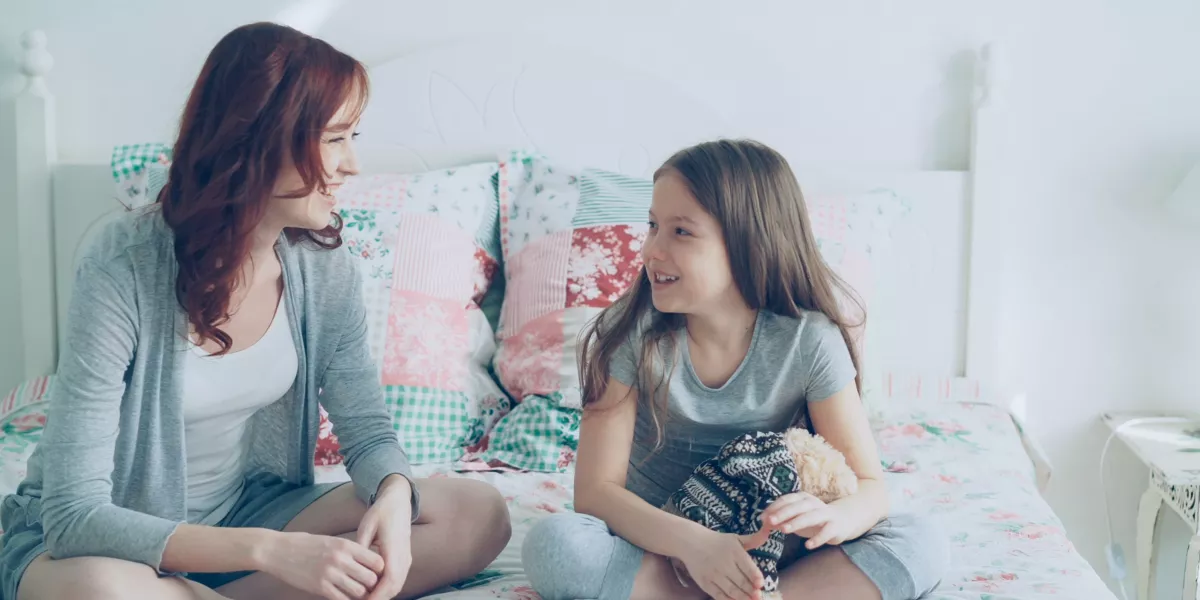 parent-support-eating-disorders Mother and teenage daughter having a supportive conversation at home